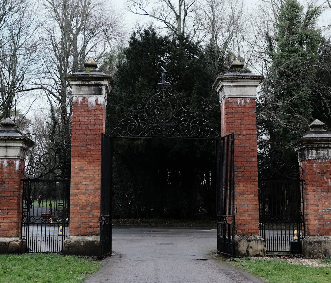 Ornamental iron gate with brick columns